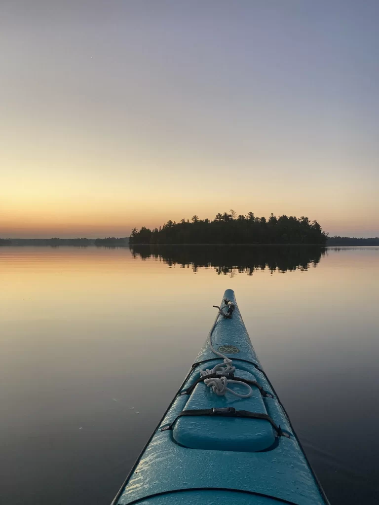 Kayak on the lake at dawn (from kayaker's POV)